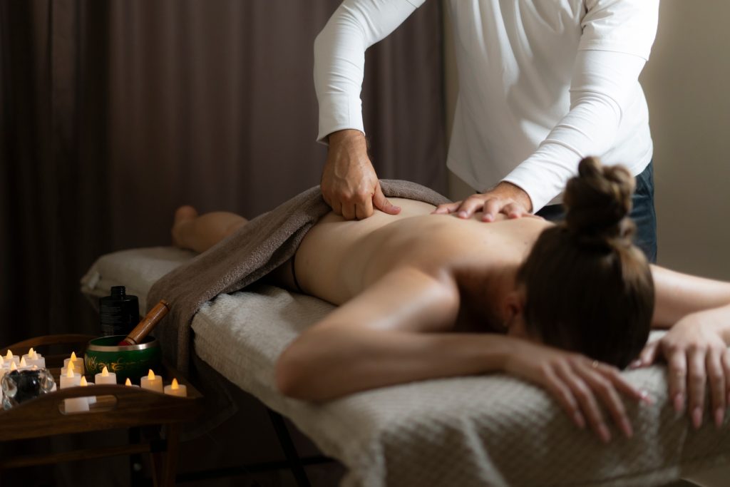 A practitioner skillfully performs a traditional thai massage on a client
